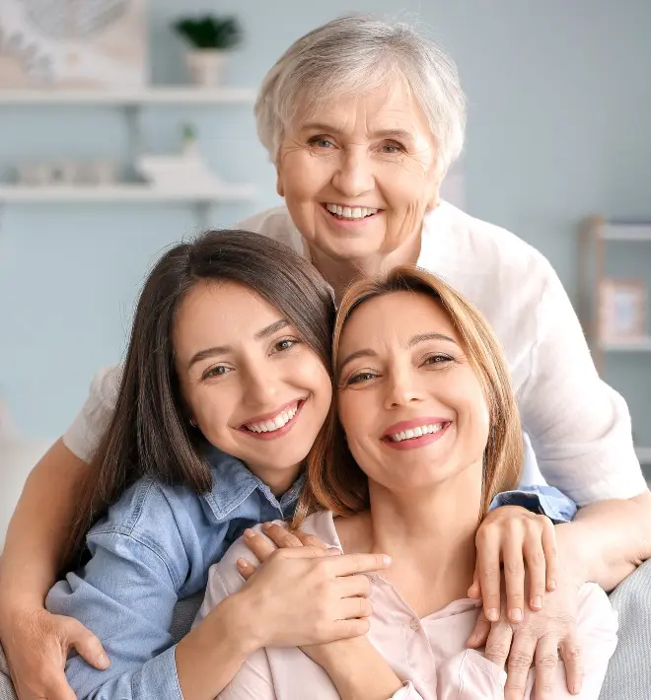 mother, daughter, and grandmother smiling